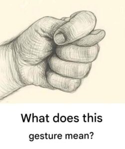 What does this gesture mean, where the thumb is trapped between the fingers?